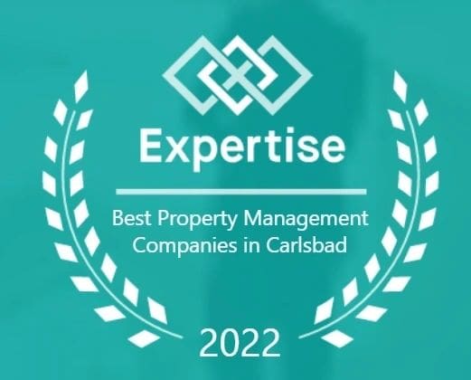 A green plaque with the words expertise best property management companies in carlsbad.